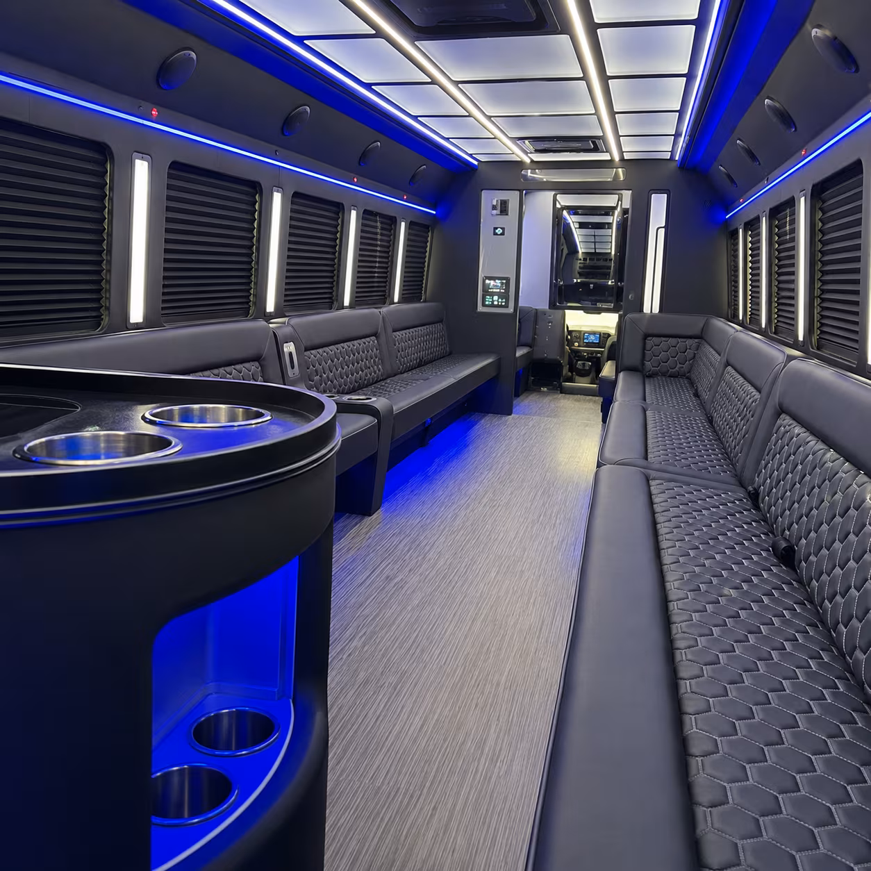 Friends laughing during a party bus celebration in Anaheim
